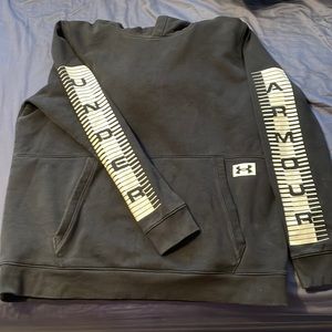 Mens Under Armour hoodie.  Black with while lettering down the sleeves.
